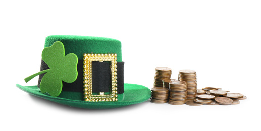 Hat, stack of gold coins and clover on white background. St. Patrick's Day celebration