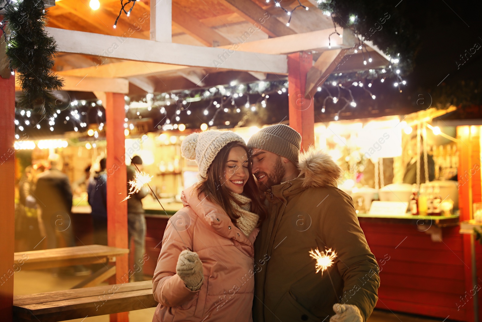 Photo of Happy couple spending time at Christmas fair