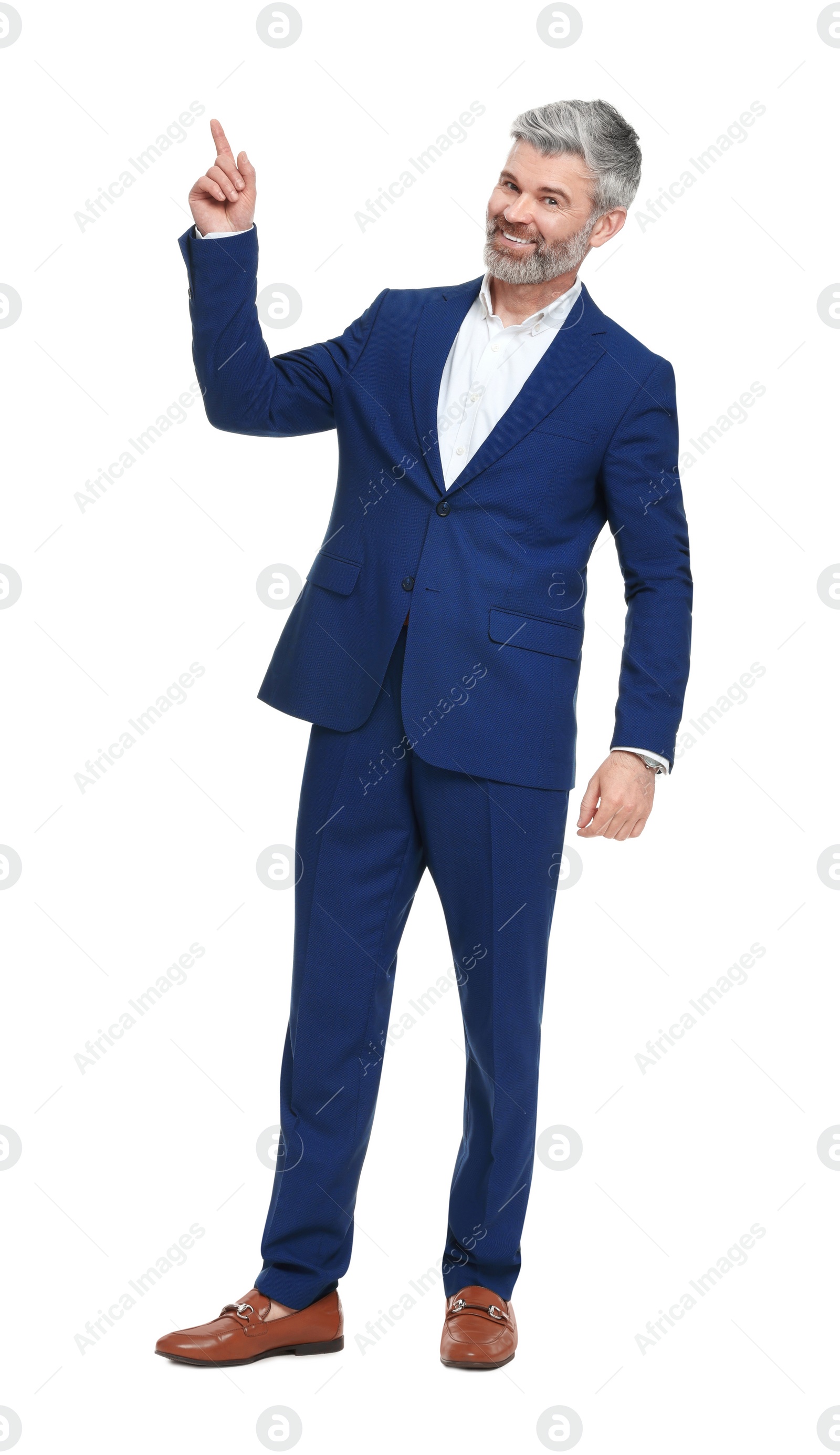 Photo of Mature businessman in stylish clothes posing on white background