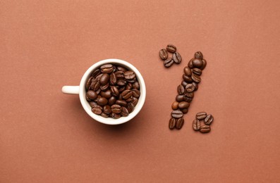 0 percent made of cup and coffee beans on color background, flat lay. Decaffeinated drink