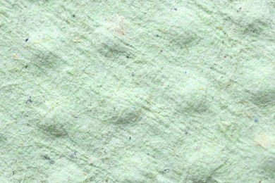 Photo of Macro photo of light green paper napkin as background