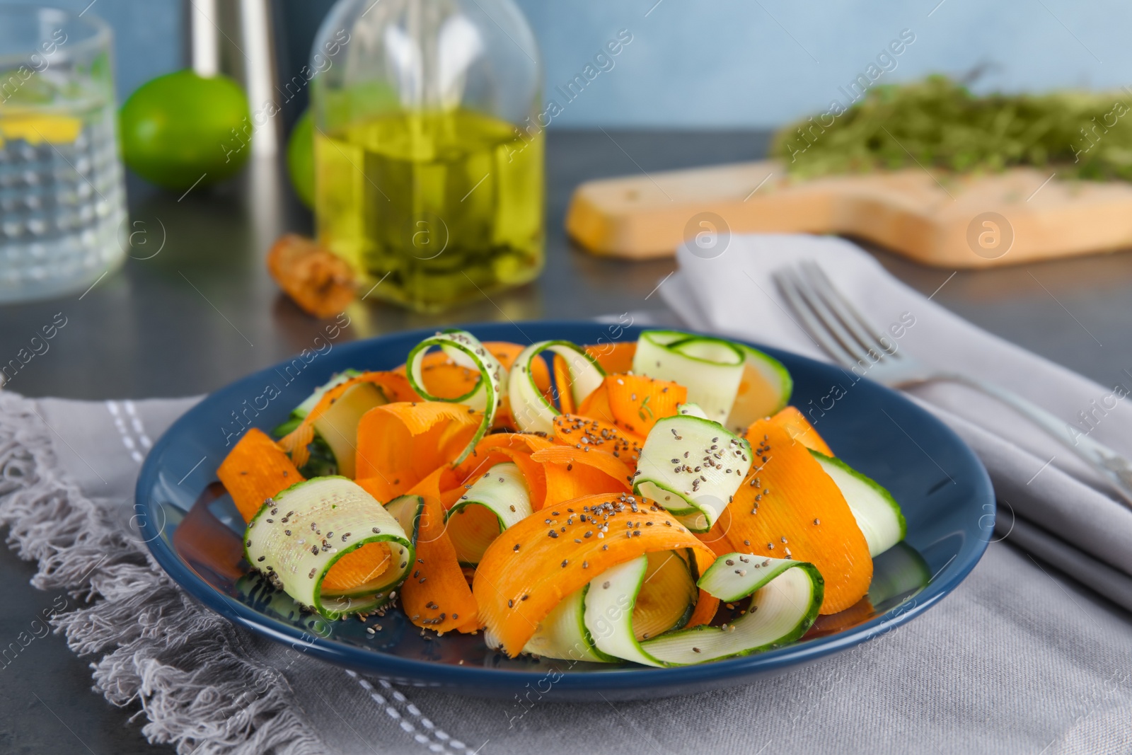 Photo of Plate with tasty carrot salad on table