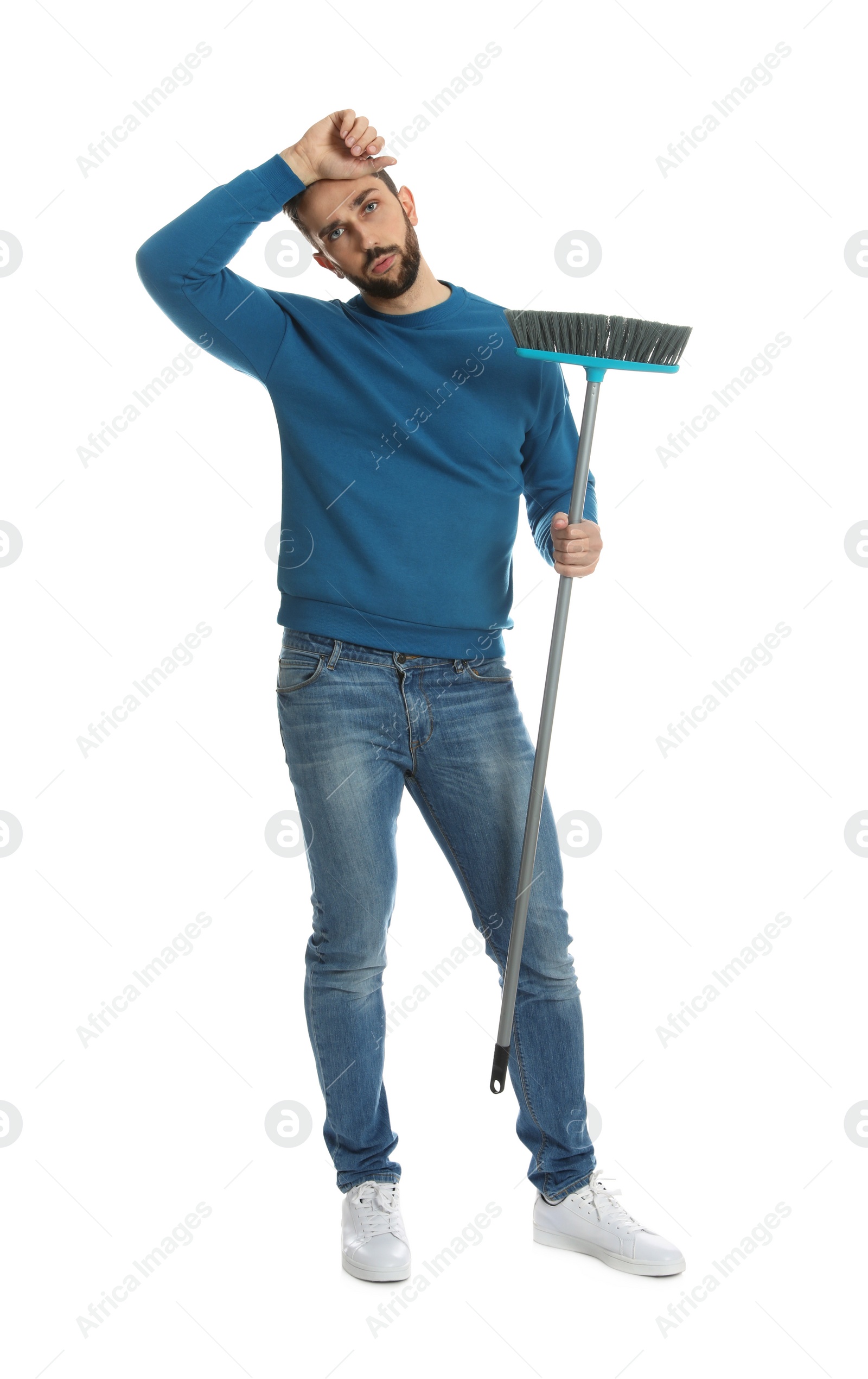 Photo of Tired man with broom on white background