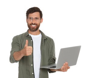 Handsome man with laptop showing thumb up gesture on white background