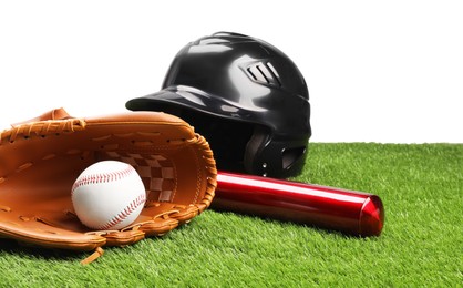 Photo of Baseball bat, ball, batting helmet and glove on artificial grass against white background