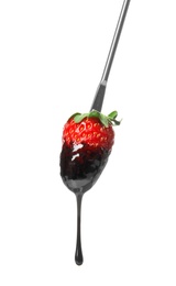 Photo of Tasty strawberry dipped into chocolate fondue on white background