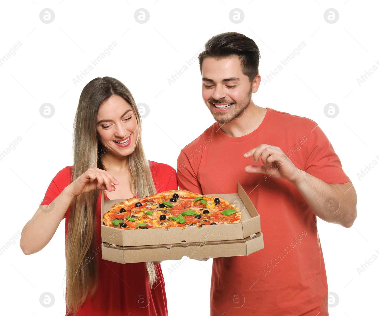 Photo of Attractive young couple with delicious pizza on white background