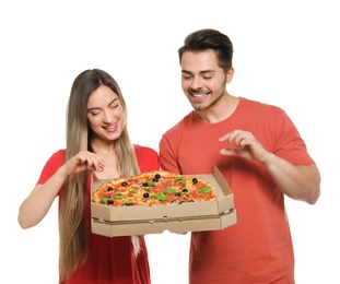 Attractive young couple with delicious pizza on white background