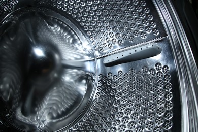 Empty washing machine drum, closeup view. Laundry day