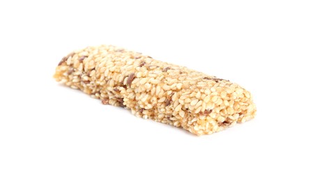 Photo of Tasty sesame seed bar isolated on white