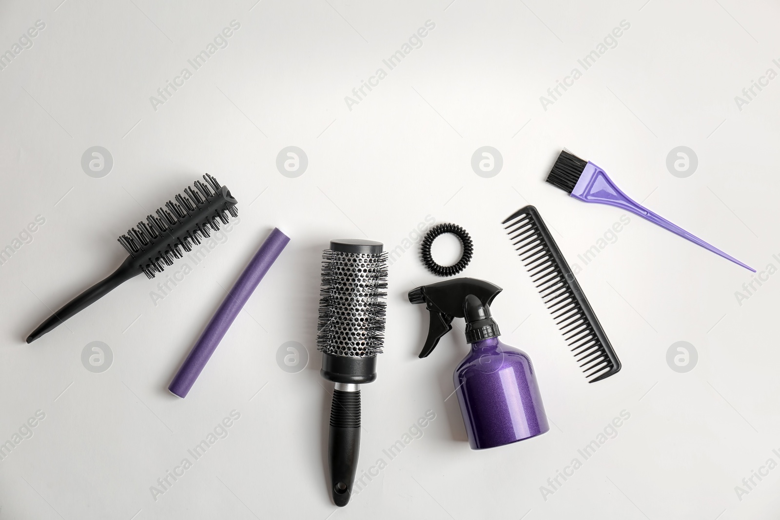 Photo of Professional hairdresser tools on white background