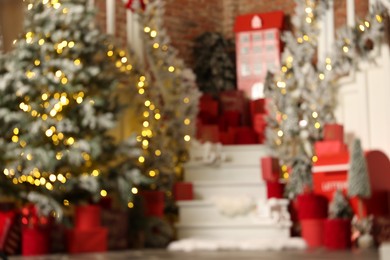 Blurred view of stylish room interior with Christmas tree and festive decor