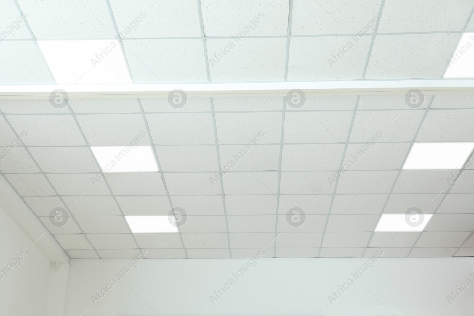 Photo of White ceiling in office room. Interior design