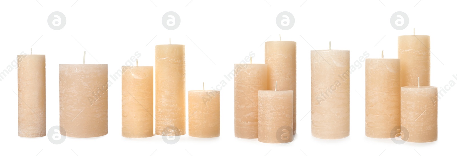 Image of Set of color wax candles on white background. Banner design