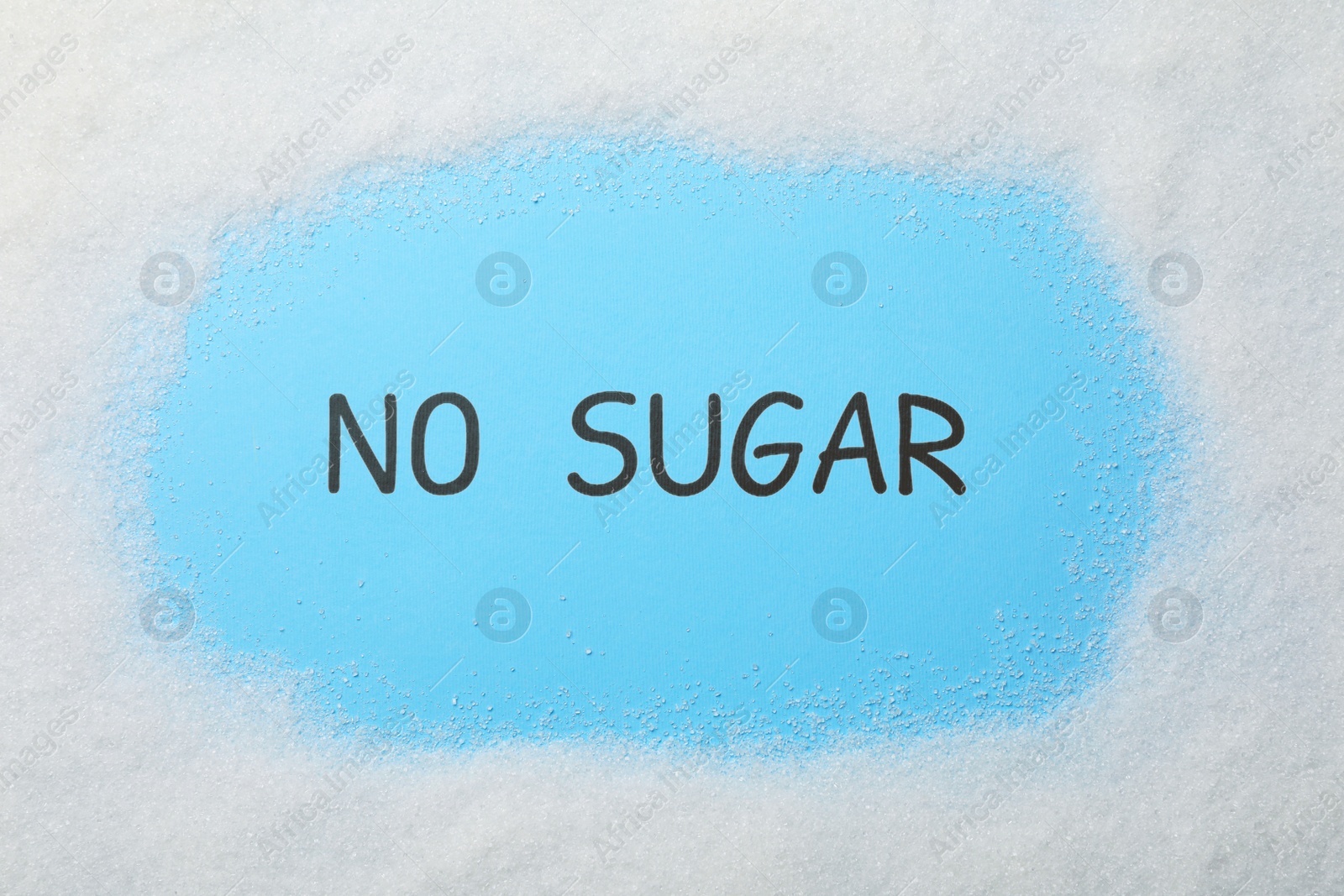 Photo of Words No Sugar on light blue background, top view