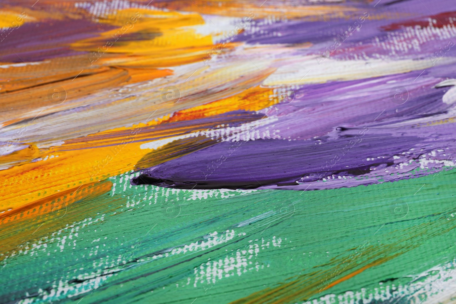 Photo of Beautiful strokes of colorful oil paints on white canvas as background, closeup