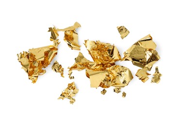Photo of Many pieces of edible gold leaf isolated on white, top view