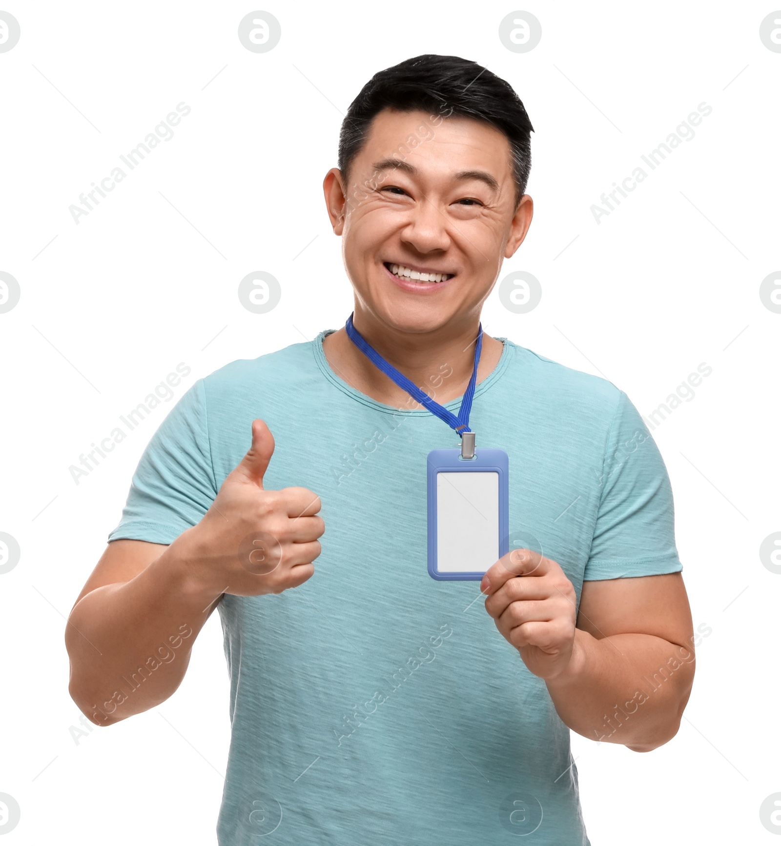 Photo of Happy asian man with vip pass badge showing thumbs up on white background