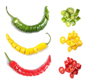 Set with different hot chili peppers on white background, top view
