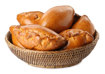 Photo of Wicker basket with delicious baked patties on white background