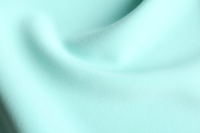 Photo of Texture of beautiful light blue fabric as background, closeup