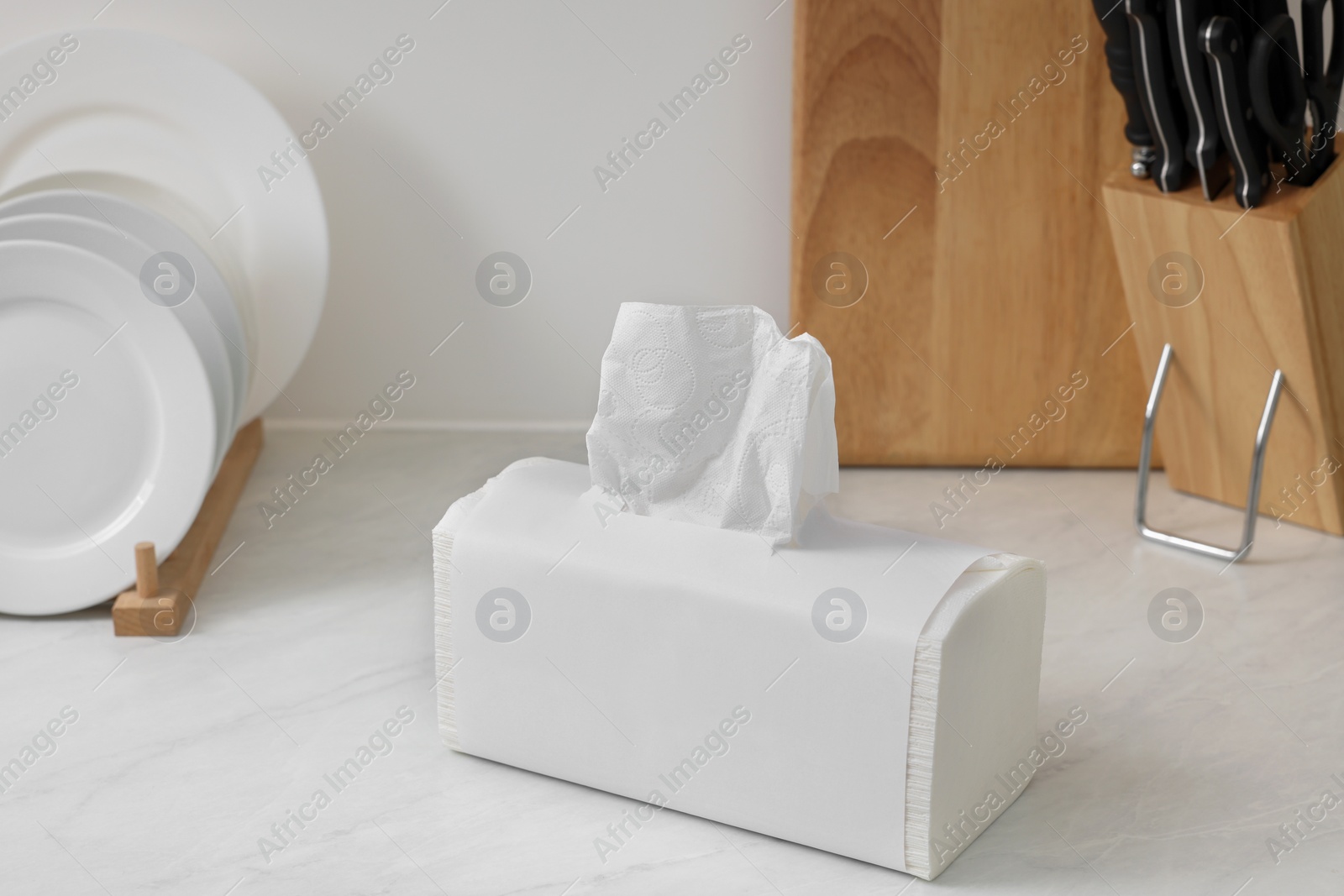 Photo of Package of paper towels on white countertop in kitchen