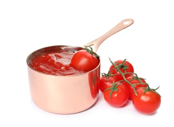 Photo of Tasty homemade tomato sauce and fresh vegetables in saucepan on white background