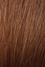 Photo of Texture of healthy red hair as background, closeup