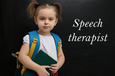 Cute little child near chalkboard and text Speech Therapist 