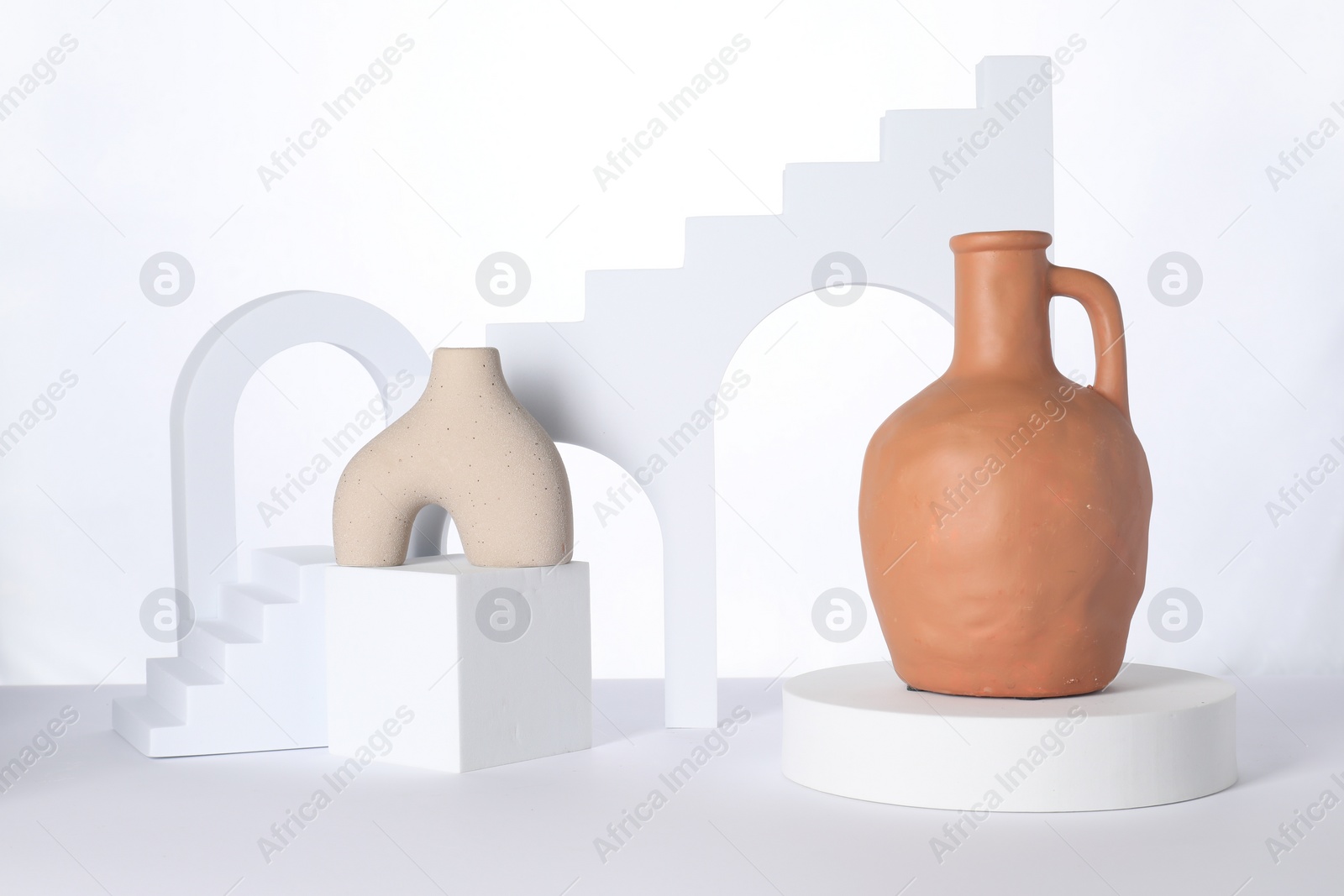 Photo of Clay flagon and decorative elements on white background