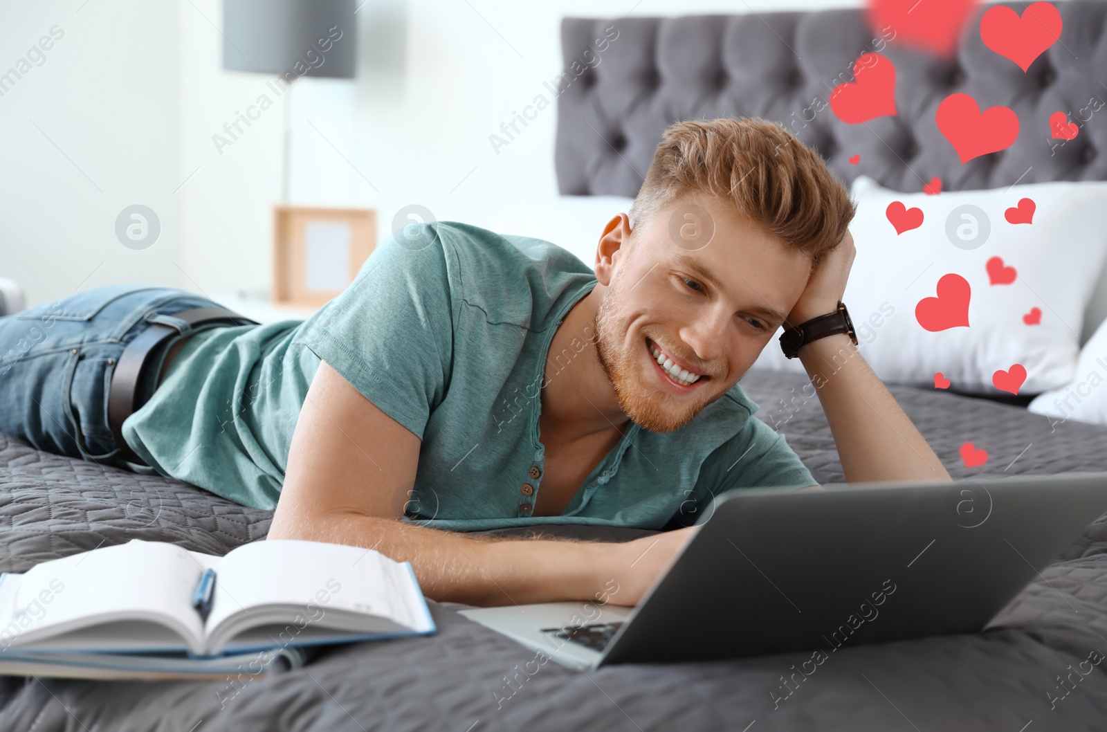 Image of Young man visiting dating site via laptop indoors