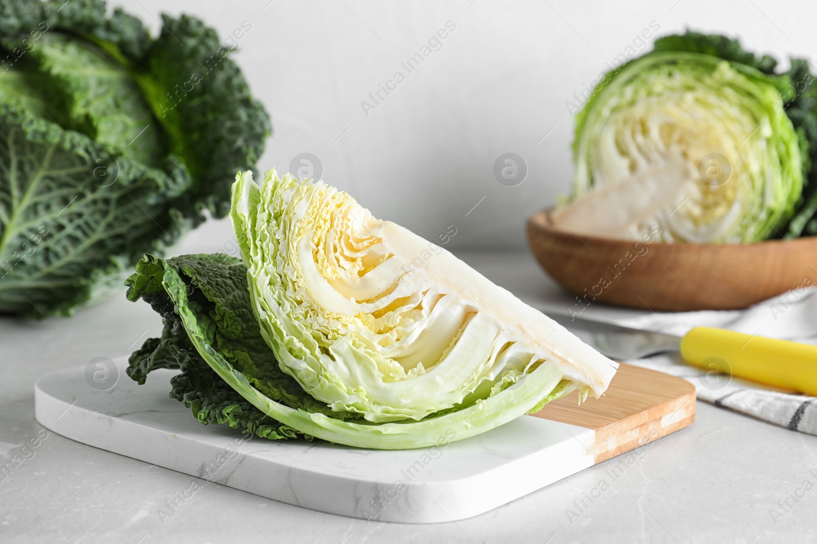 Photo of Piece of fresh green savoy cabbage on table