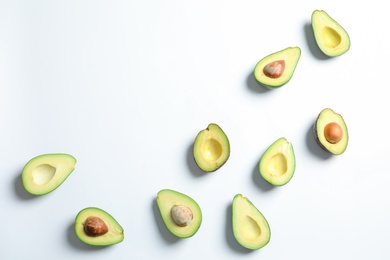 Photo of Composition with ripe fresh avocados on white background