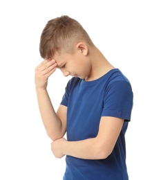 Photo of Little boy suffering from headache on white background