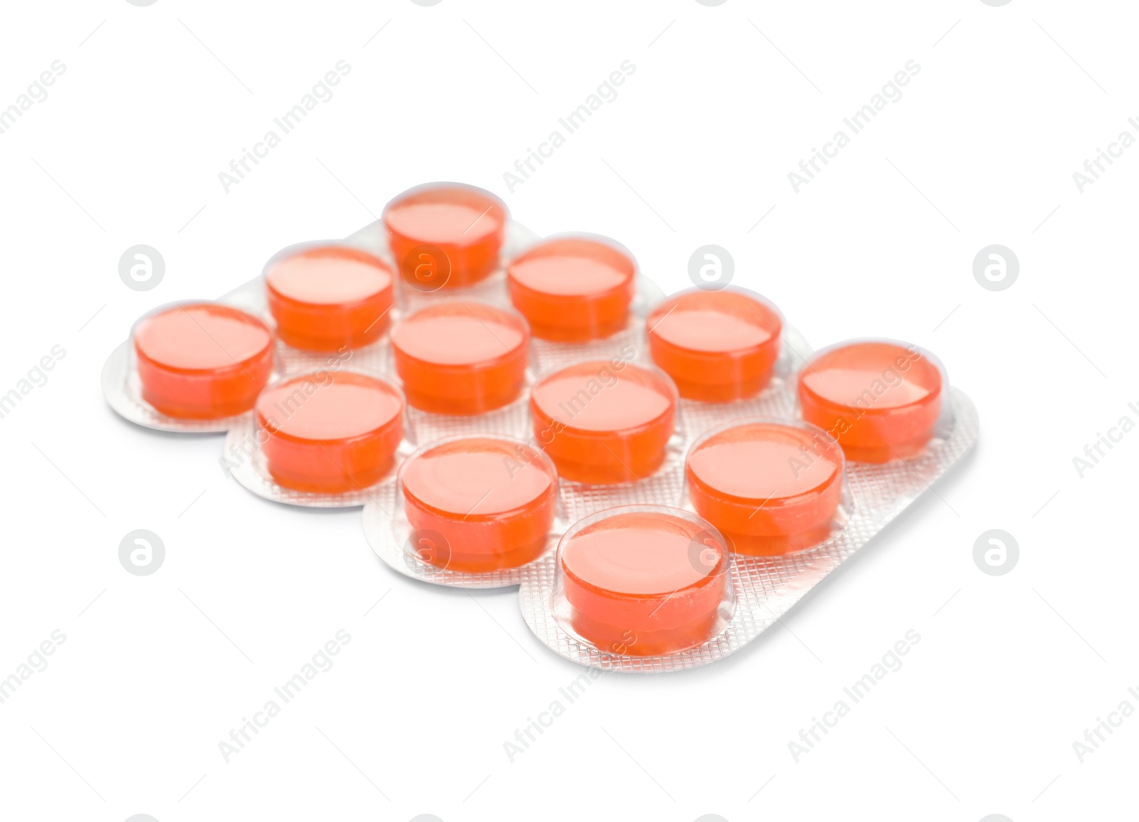 Photo of Blister with orange cough drops isolated on white