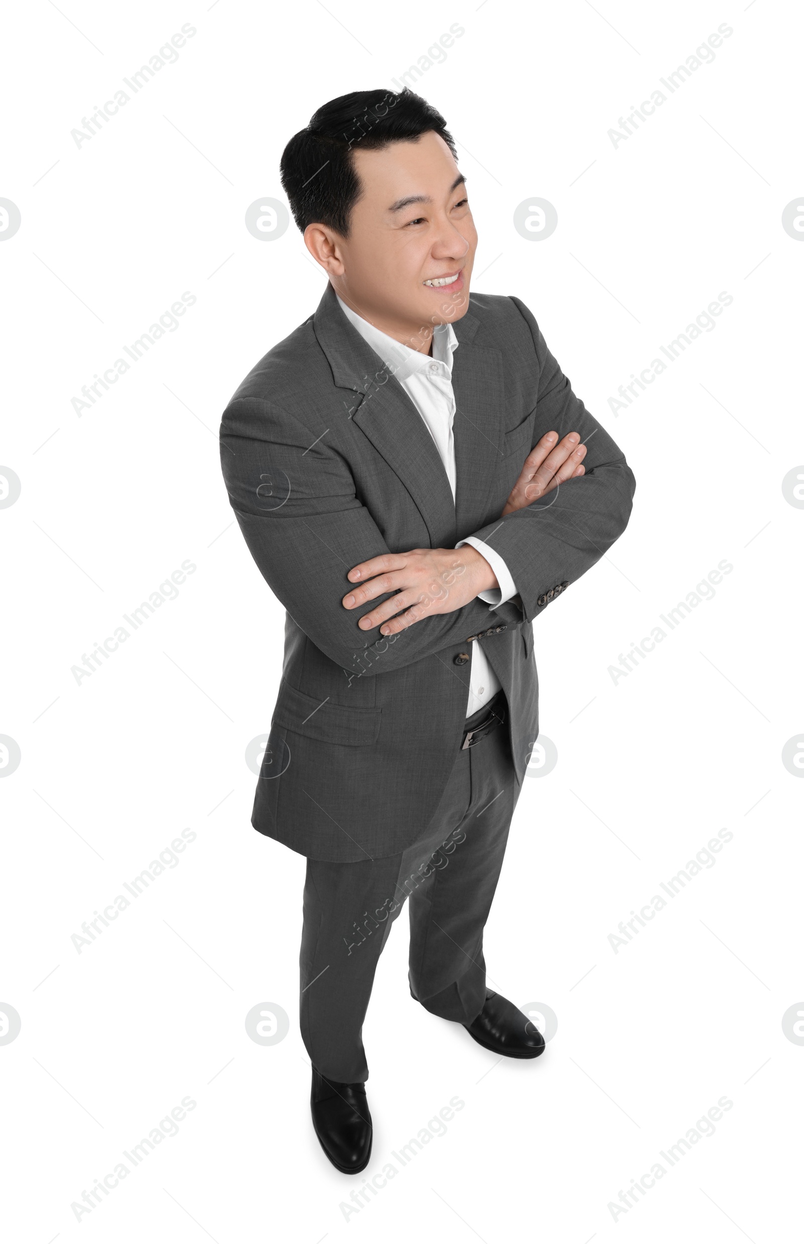 Photo of Businessman in suit posing on white background, above view