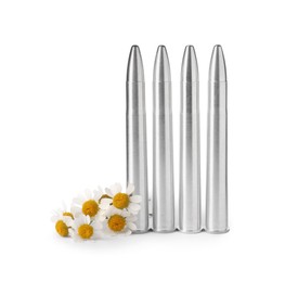 Metal bullets and beautiful flowers isolated on white