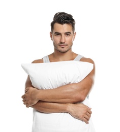 Photo of Young man with soft pillow on white background