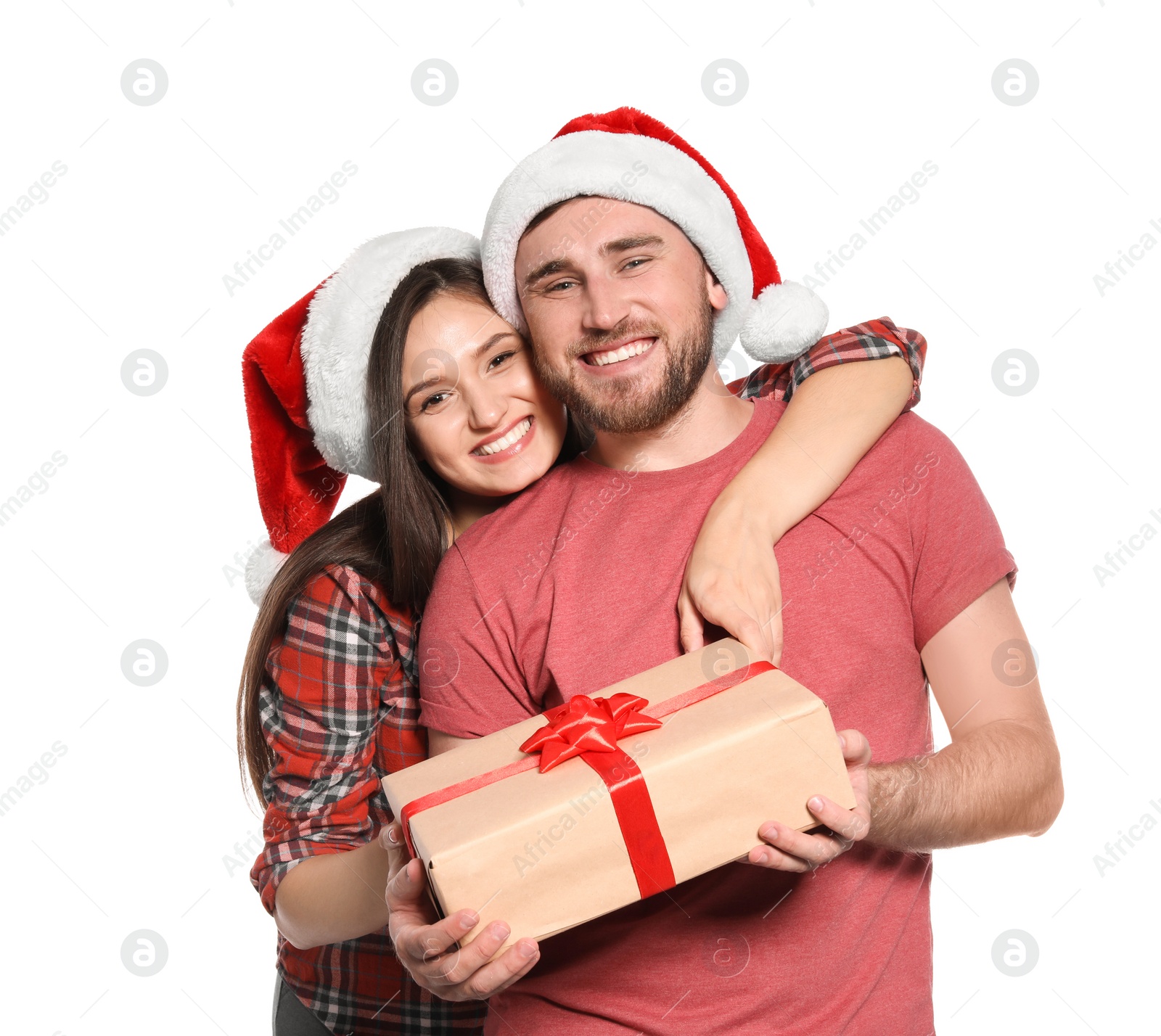 Photo of Young couple with Christmas gift on white background