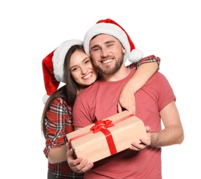 Photo of Young couple with Christmas gift on white background