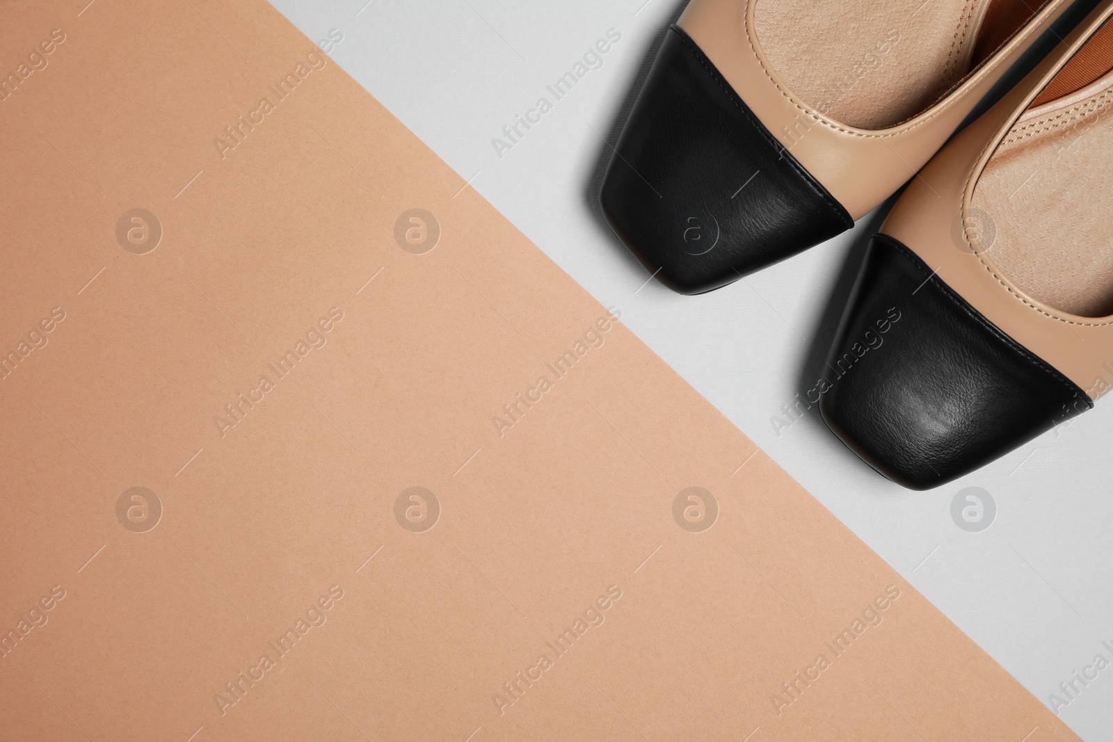 Photo of Pair of new stylish square toe ballet flats on colorful background, flat lay. Space for text