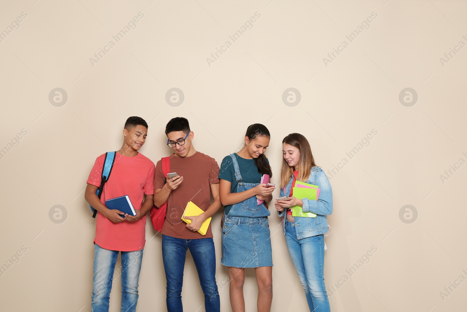 Photo of Group of teenagers on color background. Youth lifestyle and friendship