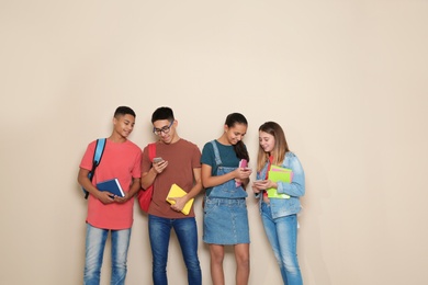 Photo of Group of teenagers on color background. Youth lifestyle and friendship