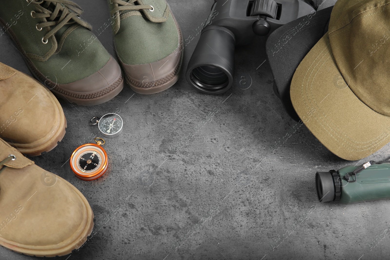 Photo of Composition with camping equipment on grey background