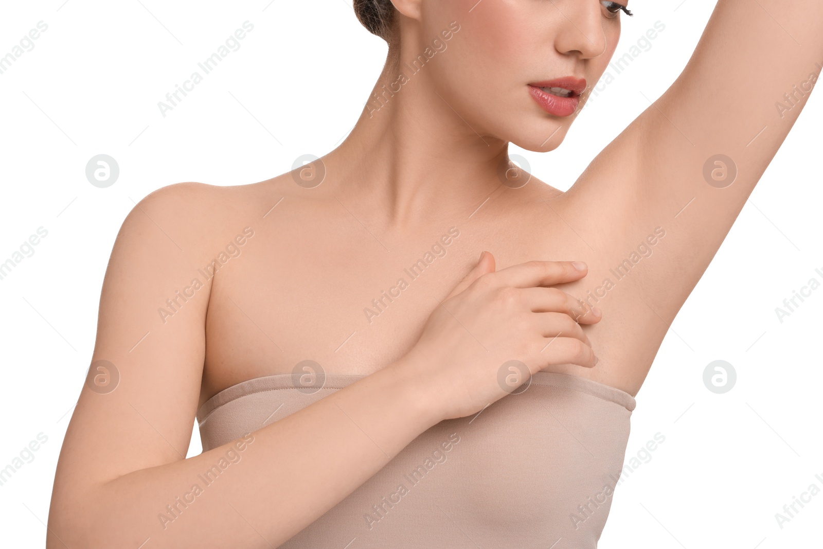 Photo of Beautiful woman showing armpit with smooth clean skin on white background