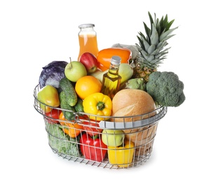 Shopping basket with grocery products on white background