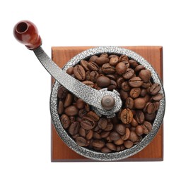 Photo of Vintage manual coffee grinder with beans isolated on white, top view