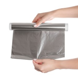 Photo of Woman holding roll of aluminum foil on white background, closeup