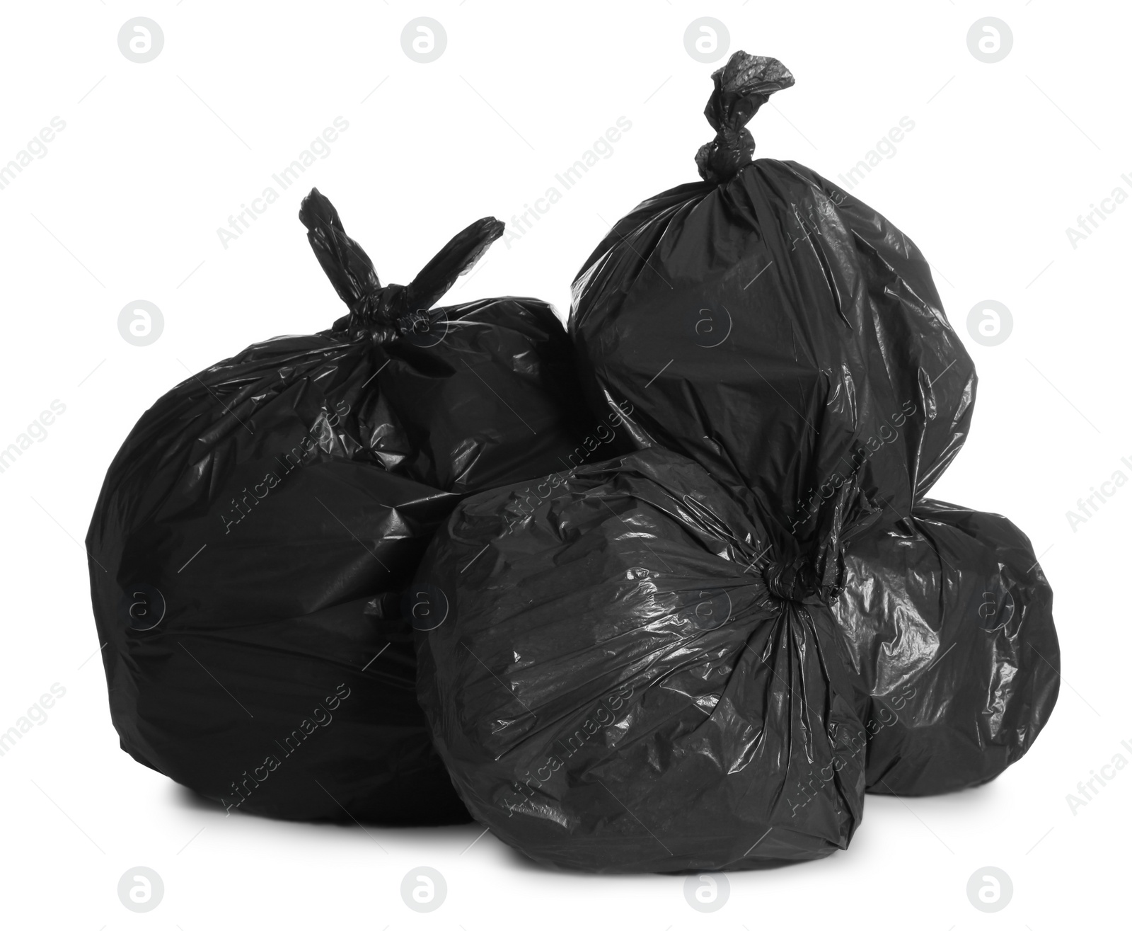 Photo of Black trash bags full of garbage on white background