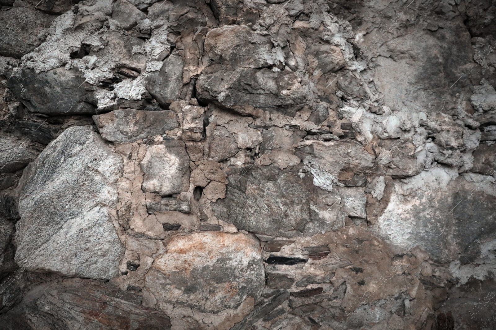 Photo of Texture of old stone surface as background, closeup